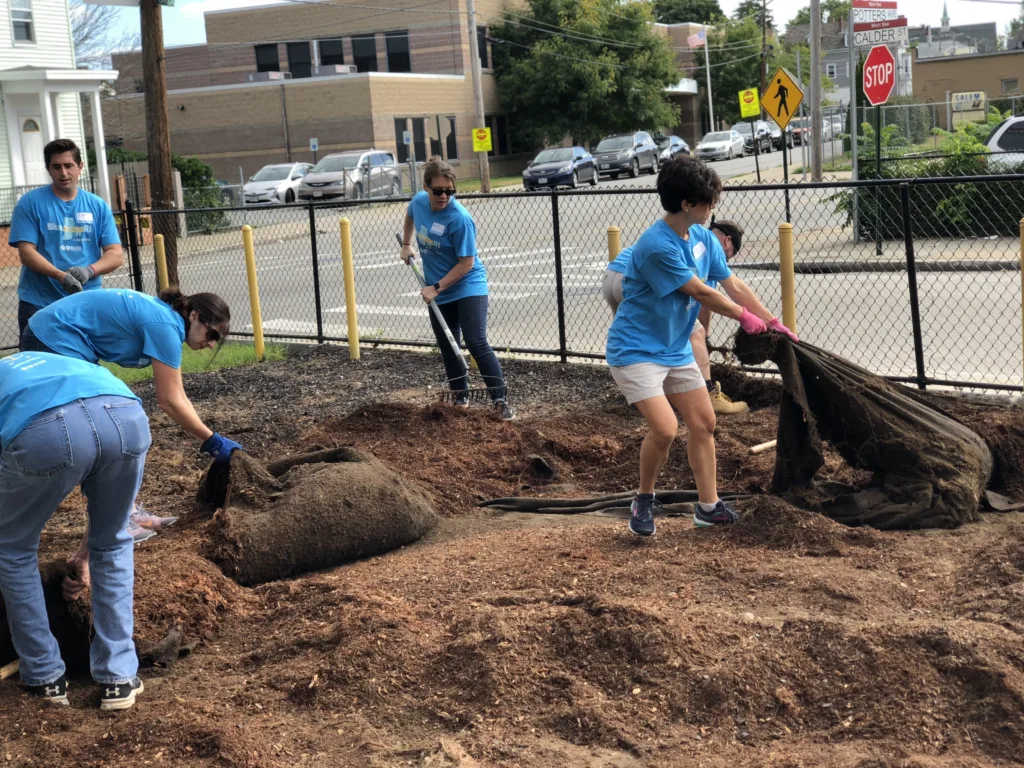 people working to maintain an outdoor space