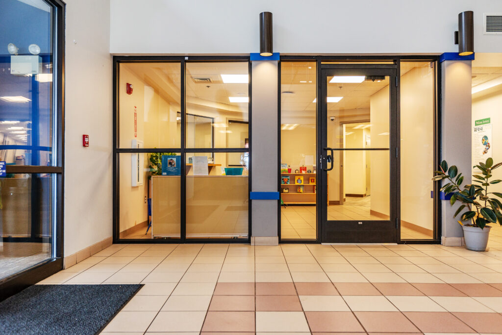 inside the Healthtrax lobby, full-length glass windows and a glass door make up the entrance to Littletrax.
